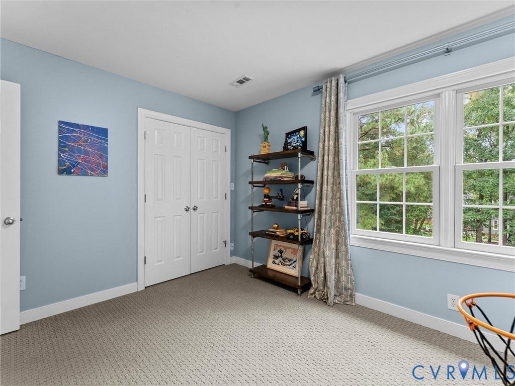 12100 English Ivy Lane, Glen Allen, VA 23059 Room featuring wall-to-wall carpeting, dual-panel closet doors, and multi-pane windows
