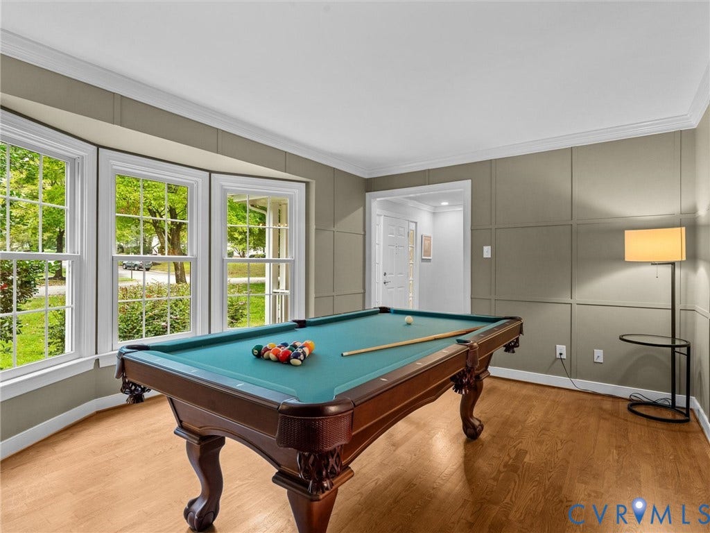 12100 English Ivy Lane, Glen Allen, VA 23059 Bay window with multiple panes, wood-finish flooring, and walls featuring decorative wainscoting paneling