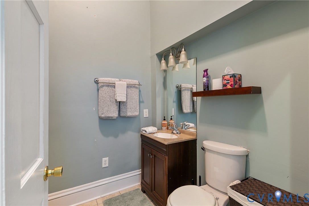 2021 North Avenue, Richmond, VA 23222 Vanity with a single basin sink and a stone-finish countertop