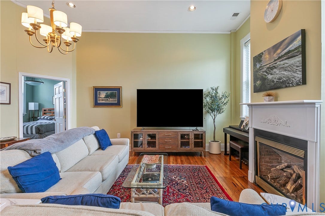 2021 North Avenue, Richmond, VA 23222 Hardwood flooring, recessed lighting, and an ornate chandelier