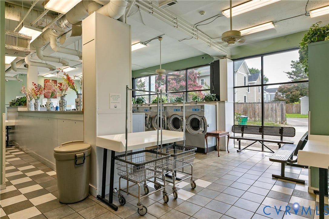 2021 North Avenue, Richmond, VA 23222 Spacious laundry area featuring tiled flooring, large windows, ceiling-mounted lighting, and exposed ductwork