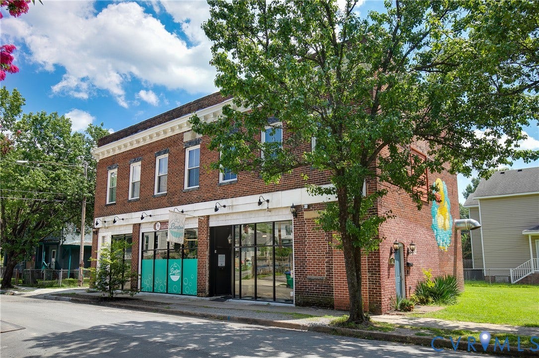 2021 North Avenue, Richmond, VA 23222 Brick exterior with white trim, large storefront windows, and decorative cornices