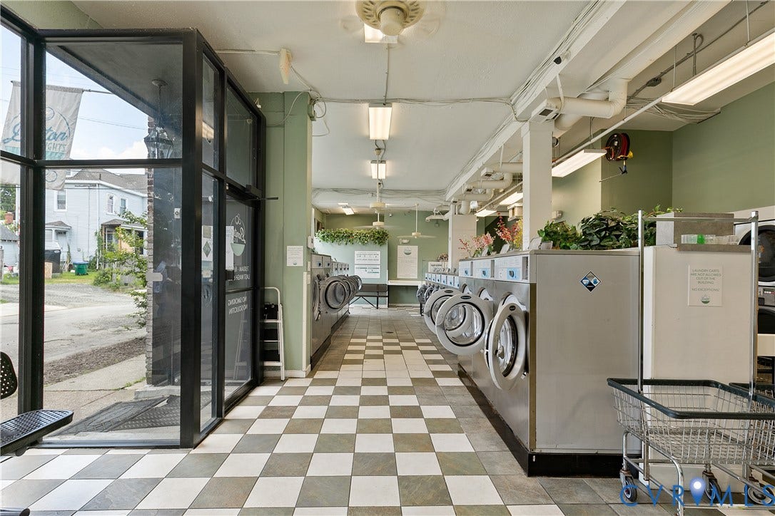 2021 North Avenue, Richmond, VA 23222 Checkerboard floor tiling, commercial-grade laundry machines, wall-mounted fluorescent lighting, ceiling fans, and a glass-paneled entry system