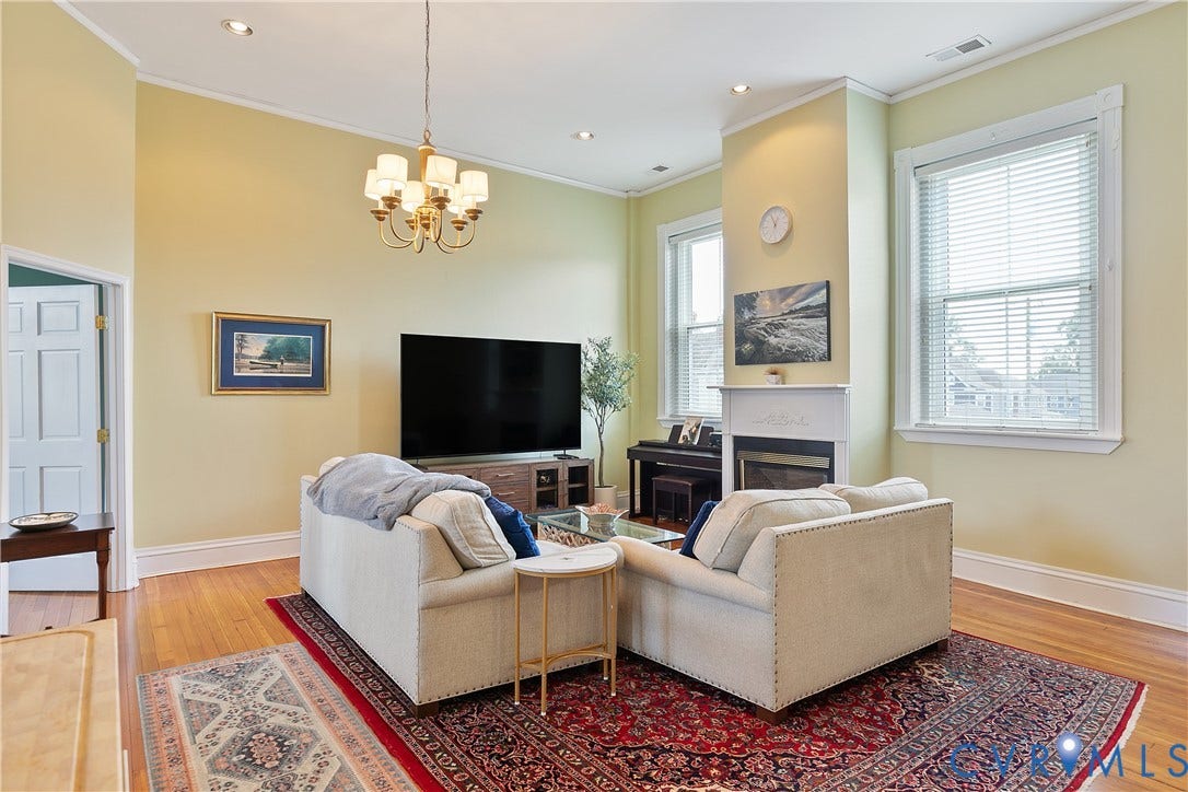 2021 North Avenue, Richmond, VA 23222 Hardwood flooring, recessed lighting, and a chandelier illuminate the living space