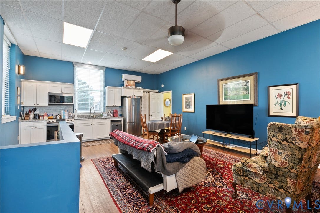 2021 North Avenue, Richmond, VA 23222 Hardwood-style flooring throughout, white upper and lower cabinetry, stainless steel appliances, recessed ceiling lighting, and a ceiling fan