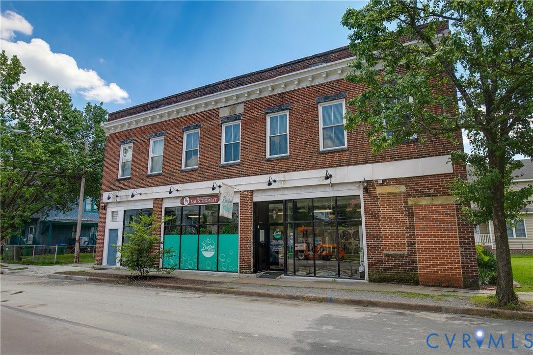 2021 North Avenue, Richmond, VA 23222 Brick building with a white cornice and multiple storefront windows