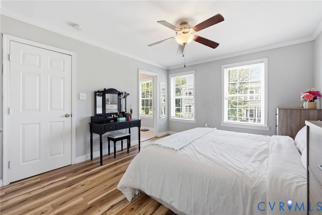 3015 M Street, Church Hill, Richmond, VA 23223 Light wood-finish flooring, ceiling fan with integrated lighting, two multi-pane windows, and a six-panel interior door