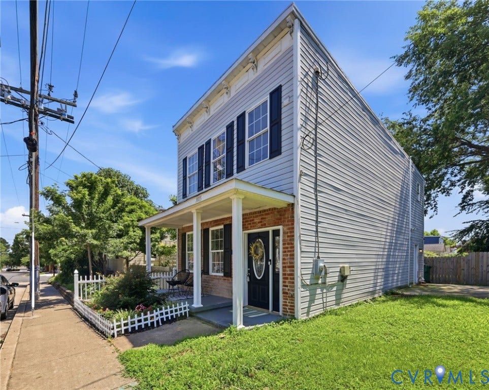 3015 M Street, Church Hill, Richmond, VA 23223 Two-story residence featuring light-colored siding and brick facade