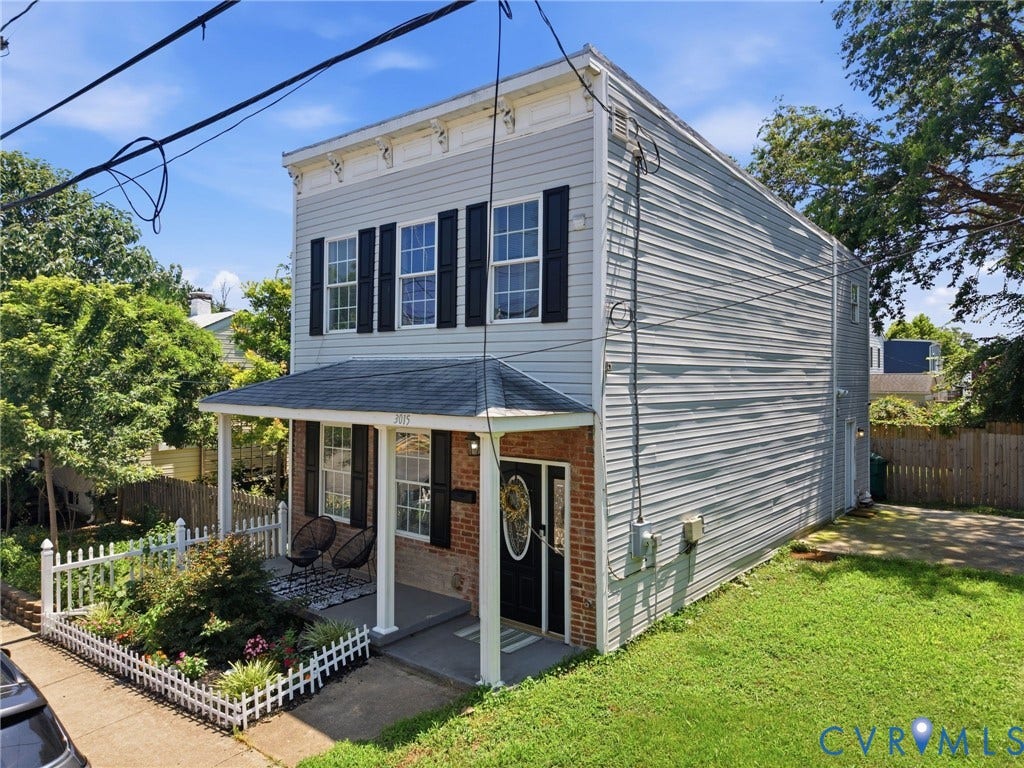 3015 M Street, Church Hill, Richmond, VA 23223 Two-story facade with light-colored siding and a brick base