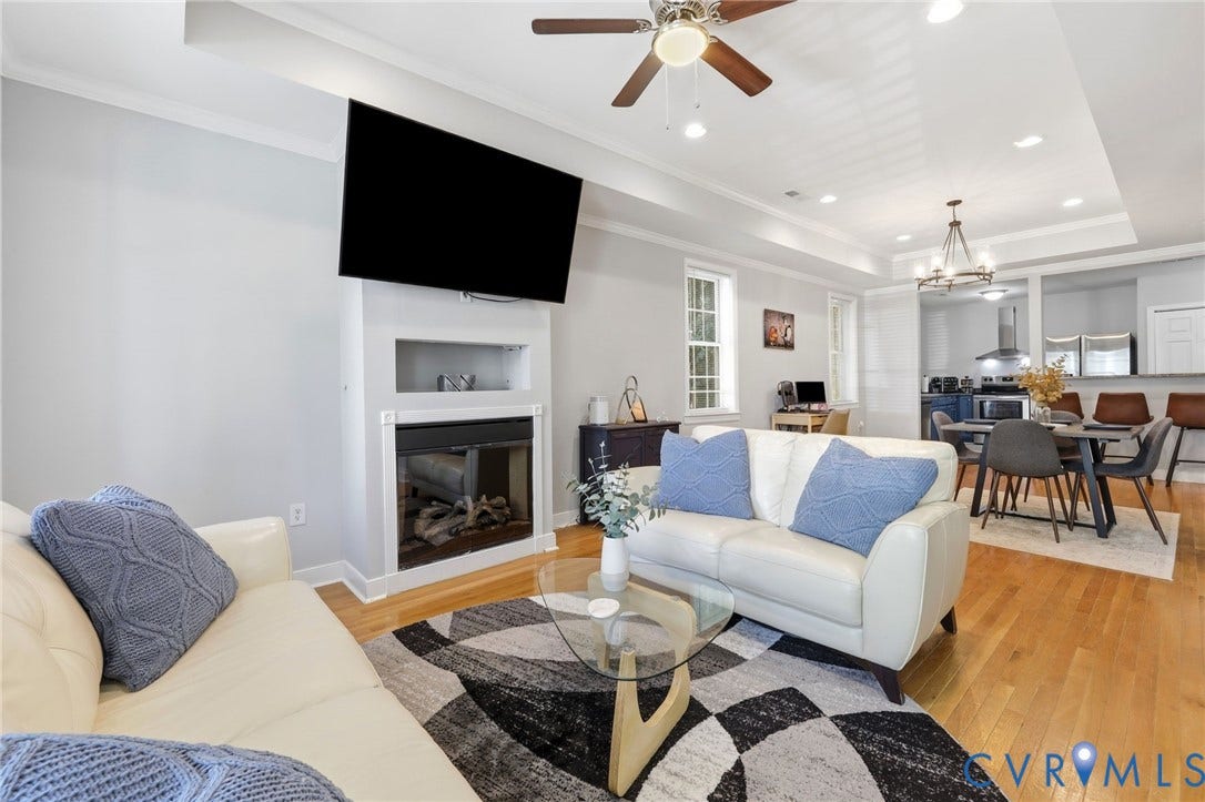 3015 M Street, Church Hill, Richmond, VA 23223 Open-concept living area featuring a fireplace, wood-finish flooring, recessed lighting, crown molding, and a ceiling fan