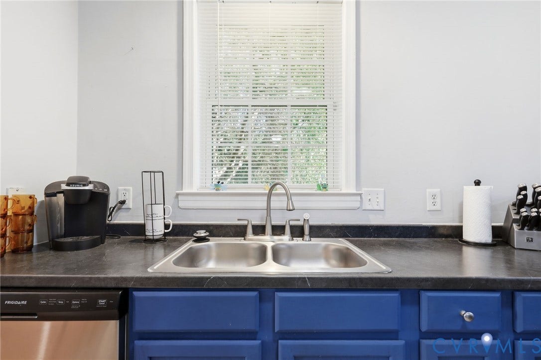 3015 M Street, Church Hill, Richmond, VA 23223 Stainless steel double-basin sink with a gooseneck faucet