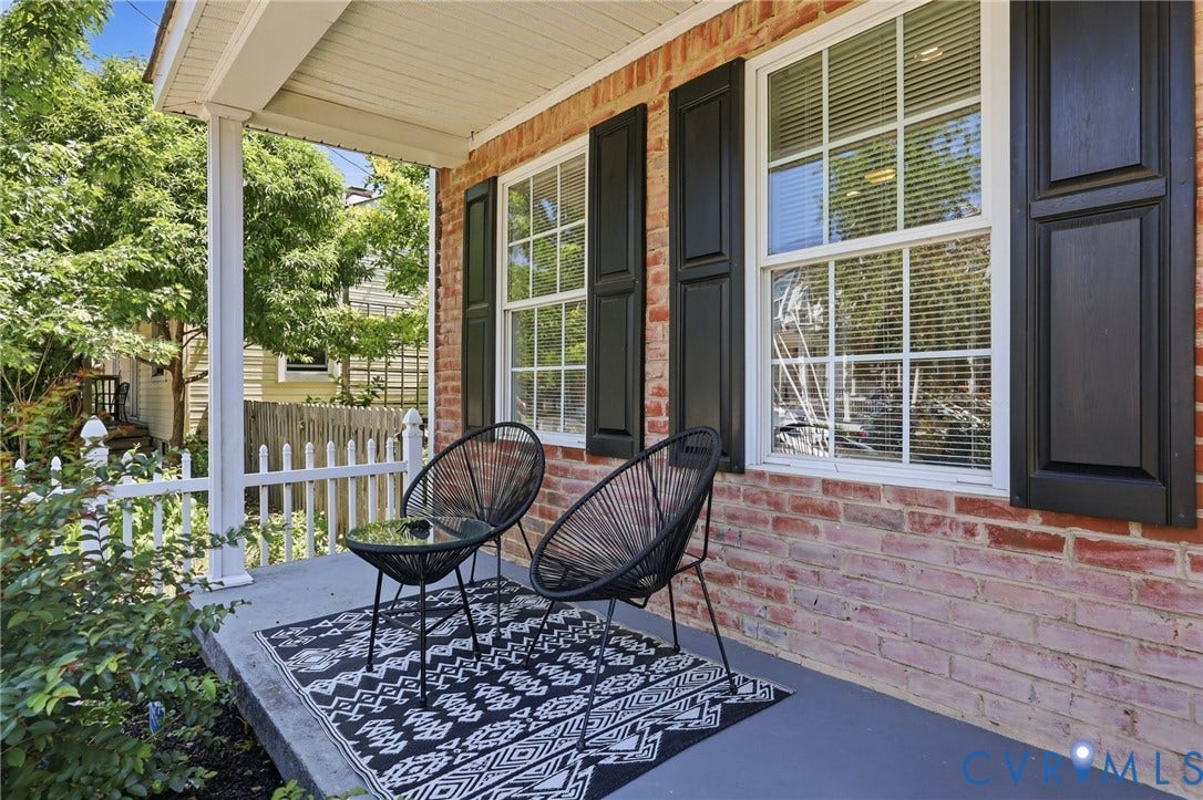 3015 M Street, Church Hill, Richmond, VA 23223 Brick exterior facade with white-framed windows, black shutters, and a covered porch