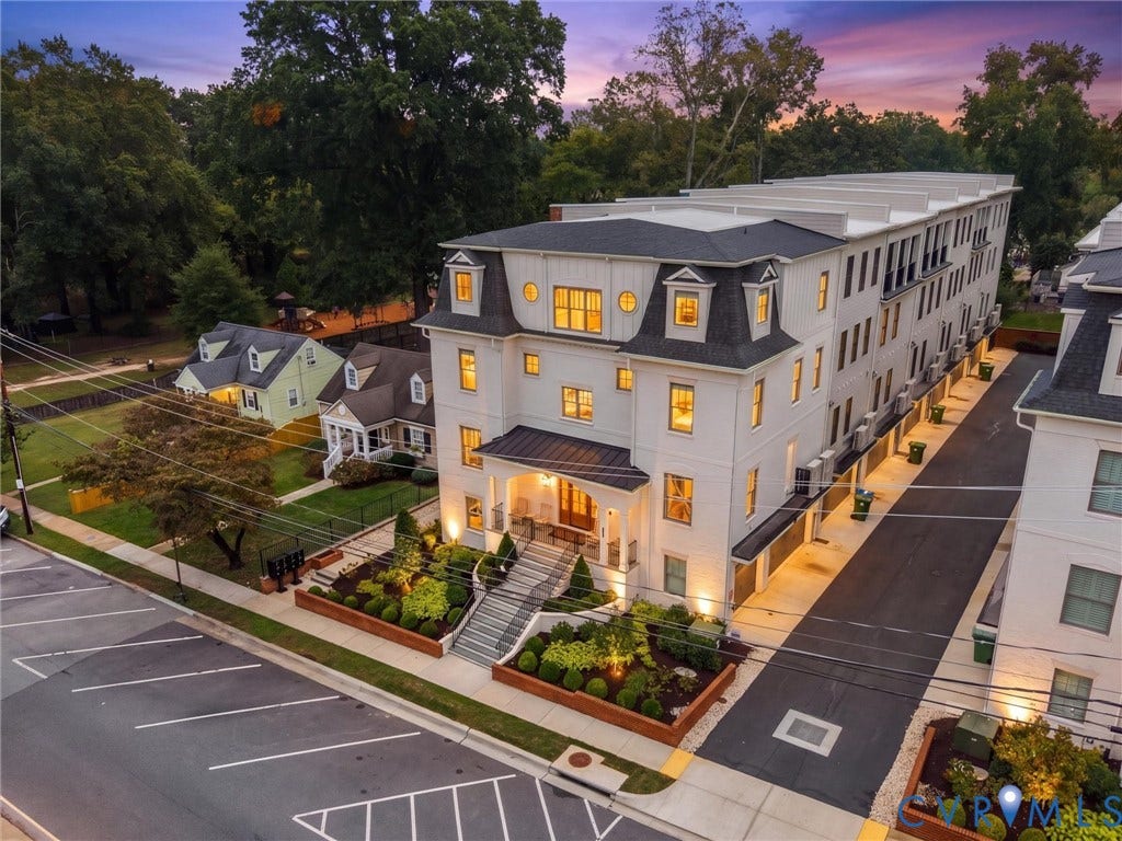 511 Libbie Avenue, #A, The Row At Westhampton, Richmond, VA 23226 Four-story building with a white exterior, dormer windows, and a prominent front entrance with a covered porch
