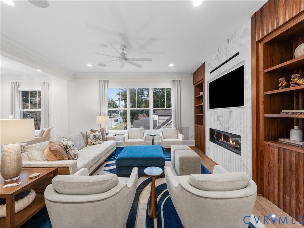 511 Libbie Avenue, #A, The Row At Westhampton, Richmond, VA 23226 Recessed lighting, wood-finish flooring, ceiling fan, built-in shelving, and a linear fireplace feature