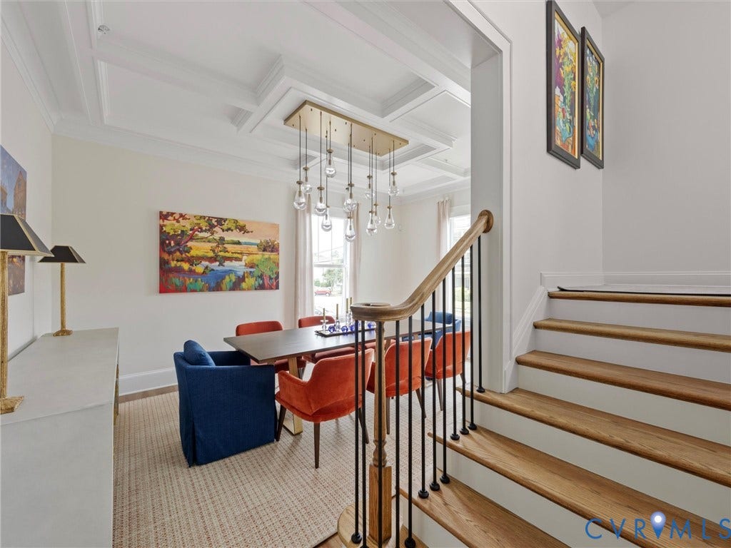 511 Libbie Avenue, #A, The Row At Westhampton, Richmond, VA 23226 Hardwood staircase with a wood handrail and black iron balusters