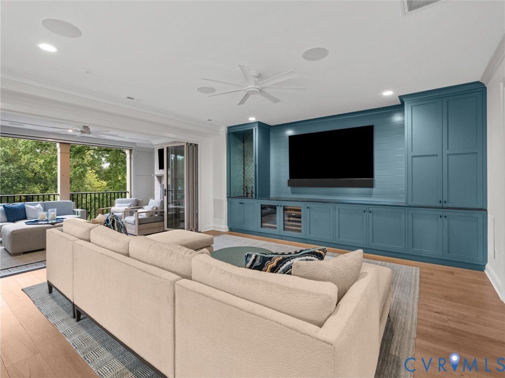 511 Libbie Avenue, #A, The Row At Westhampton, Richmond, VA 23226 Custom built-in cabinetry with integrated beverage storage, rich wood-finish flooring, recessed lighting, and a spacious balcony with a black railing