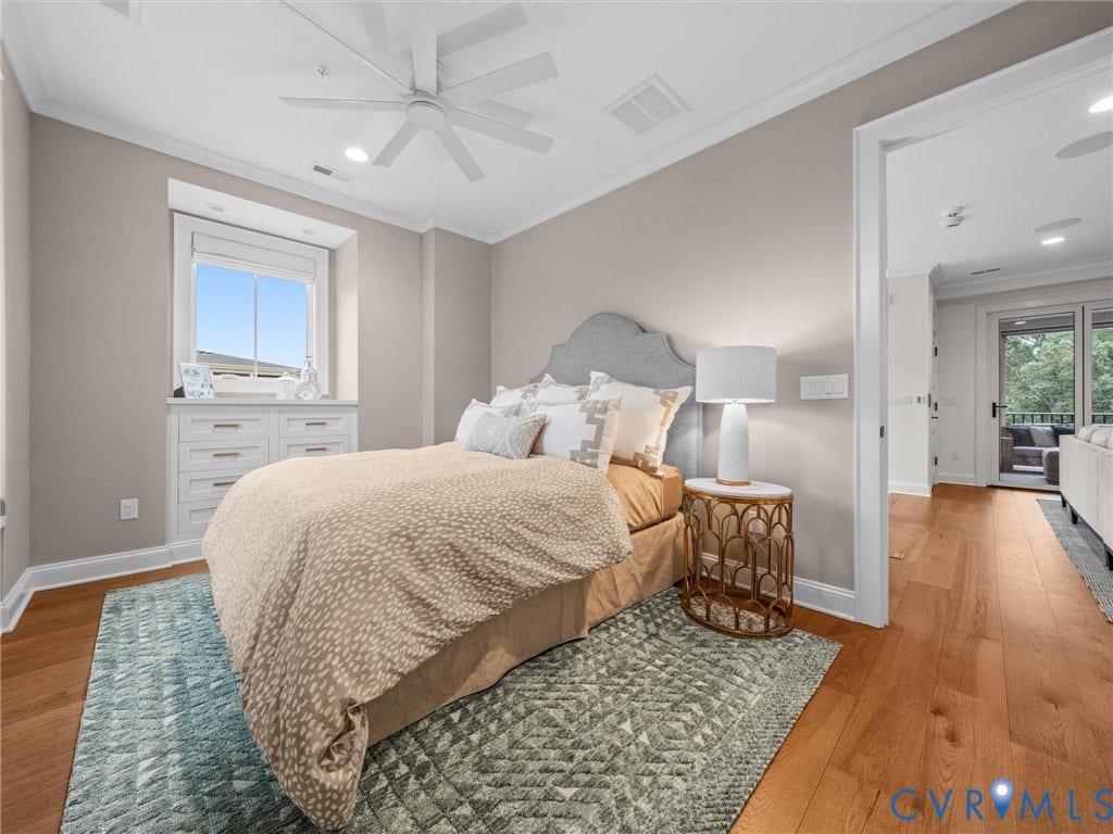 511 Libbie Avenue, #A, The Row At Westhampton, Richmond, VA 23226 Hardwood flooring, crown molding, built-in window seating with drawer storage, recessed lighting, and a ceiling fan