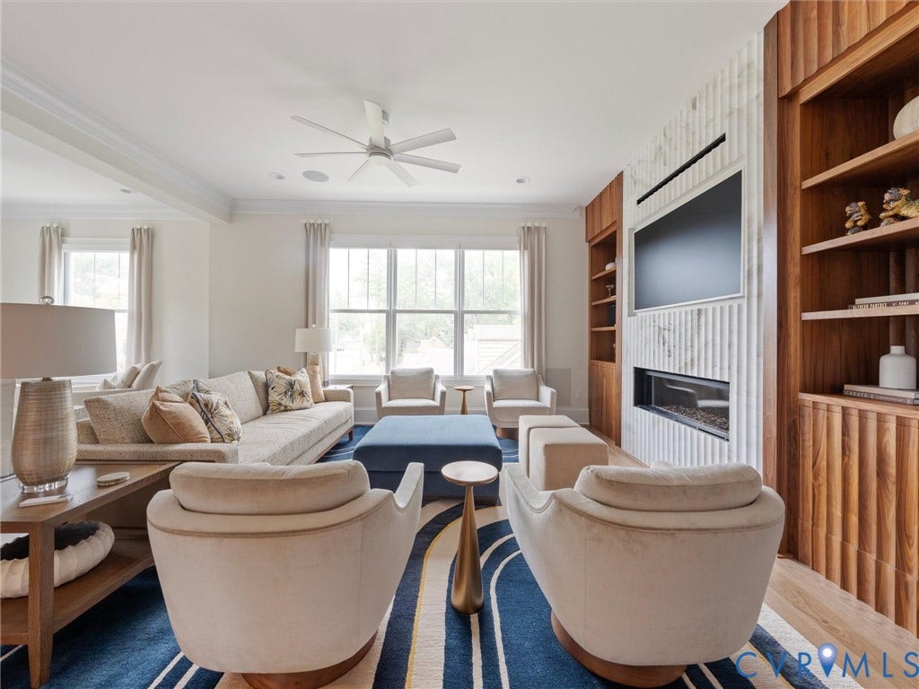 511 Libbie Avenue, #A, The Row At Westhampton, Richmond, VA 23226 Integrated linear fireplace, wall-mounted television, and custom built-in shelving