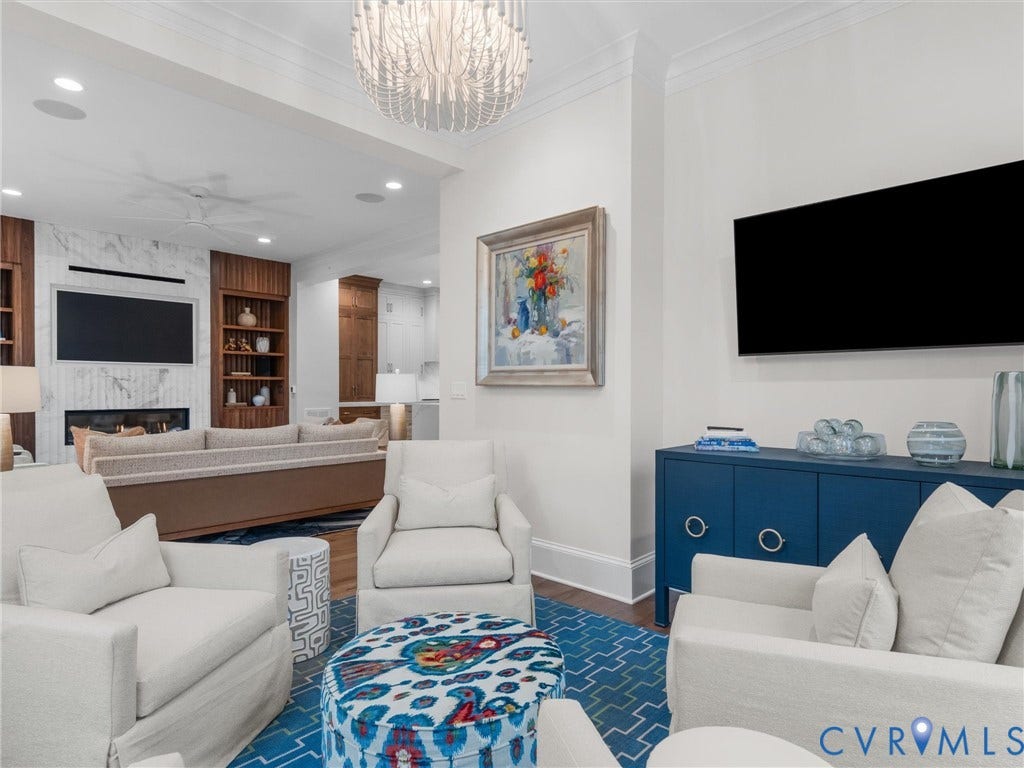 511 Libbie Avenue, #A, The Row At Westhampton, Richmond, VA 23226 Recessed lighting, crown molding, wood-finish flooring, built-in shelving, and a marble-clad fireplace