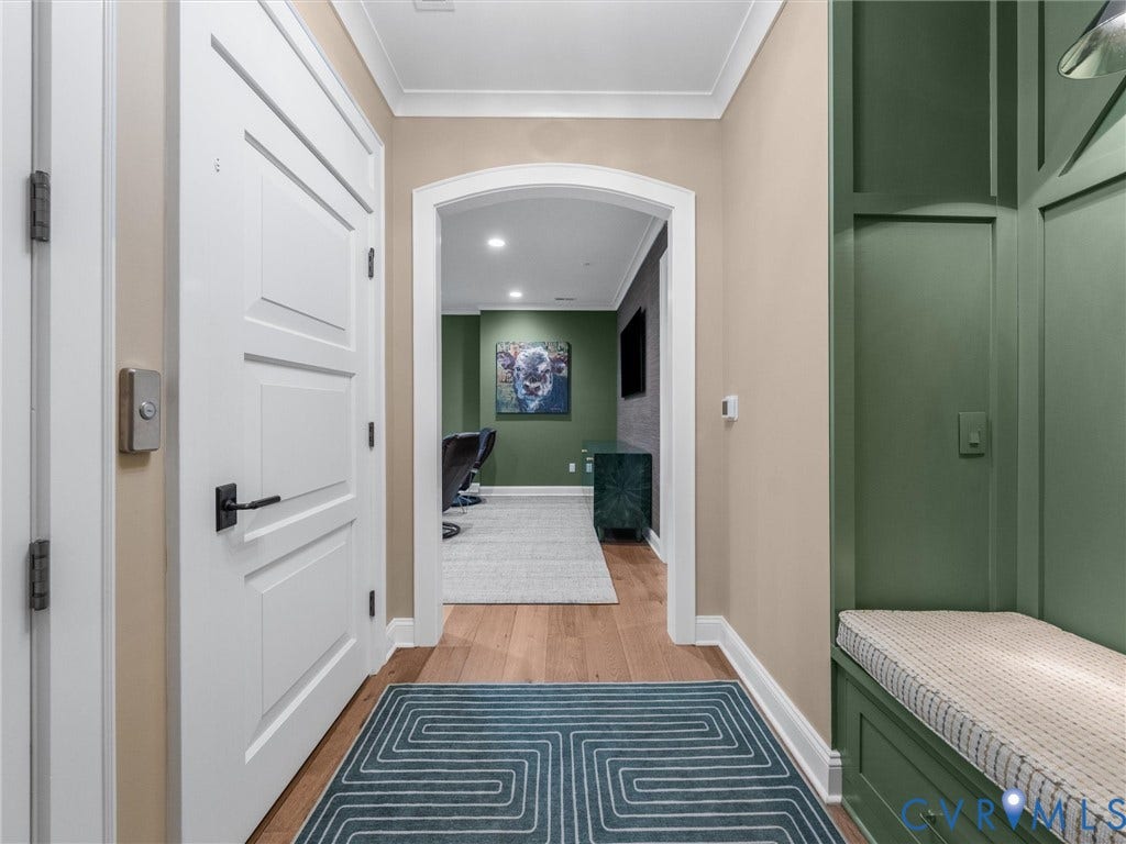 511 Libbie Avenue, #A, The Row At Westhampton, Richmond, VA 23226 Integrated built-in seating with cushion, wood-finish flooring, and an arched doorway