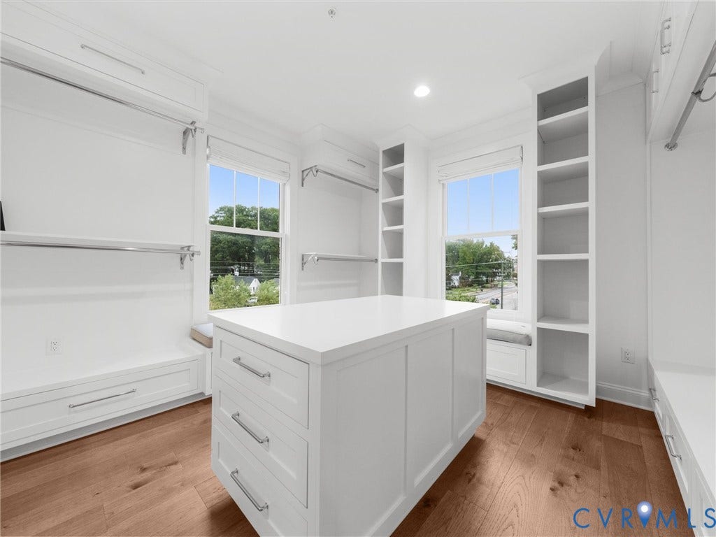 511 Libbie Avenue, #A, The Row At Westhampton, Richmond, VA 23226 Built-in white cabinetry, central island with drawers, wood-finish flooring, two large windows, and recessed lighting