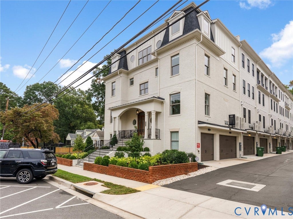 511 Libbie Avenue, #A, The Row At Westhampton, Richmond, VA 23226 White brick and siding exterior with dark shingle mansard roof