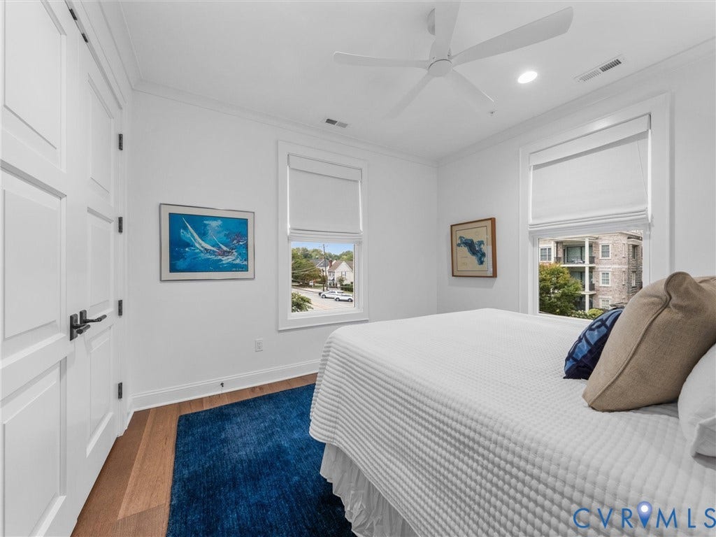 511 Libbie Avenue, #A, The Row At Westhampton, Richmond, VA 23226 Recessed lighting, wood-finish flooring, white paneled doors with black hardware, and a ceiling fan