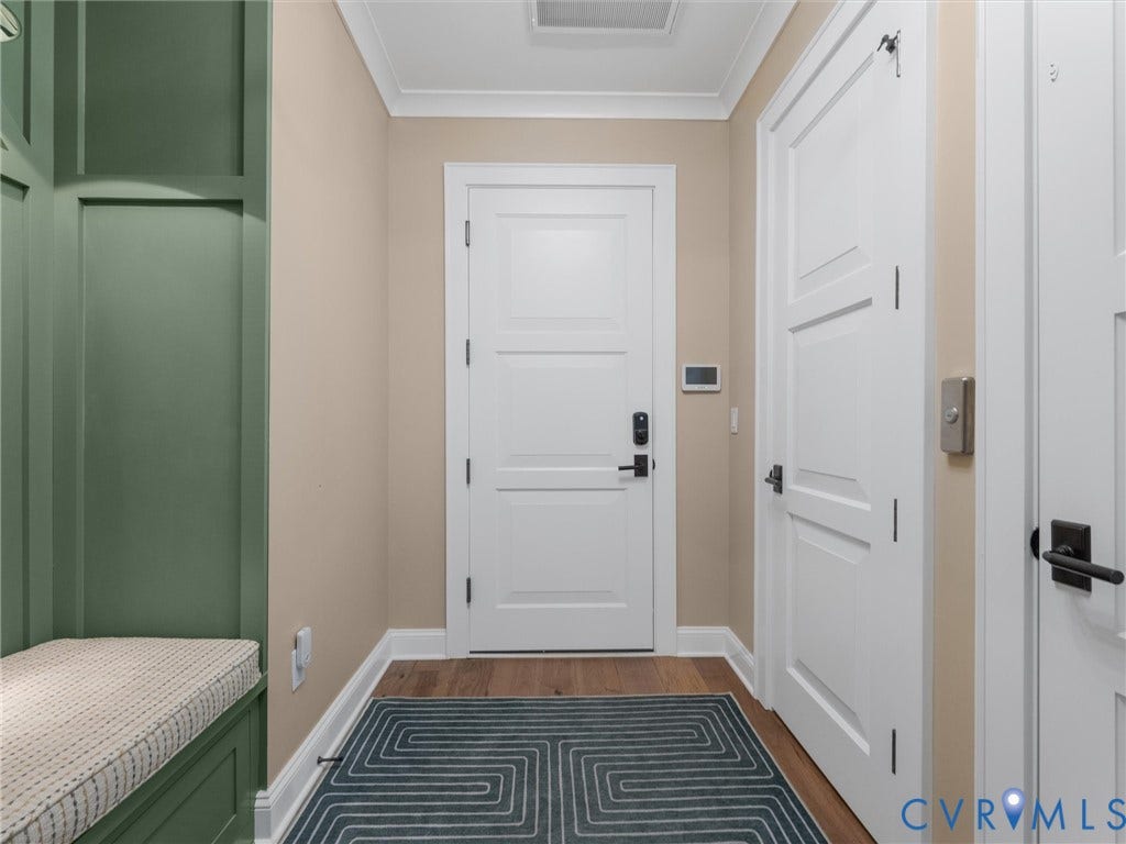 511 Libbie Avenue, #A, The Row At Westhampton, Richmond, VA 23226 Built-in bench seating with paneling, wood-finish flooring, white paneled doors, and crown molding
