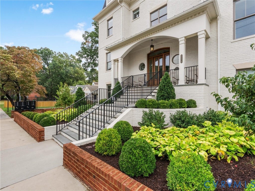 511 Libbie Avenue, #A, The Row At Westhampton, Richmond, VA 23226 White brick exterior featuring a covered entry, wood-finish double front doors, and an arched transom