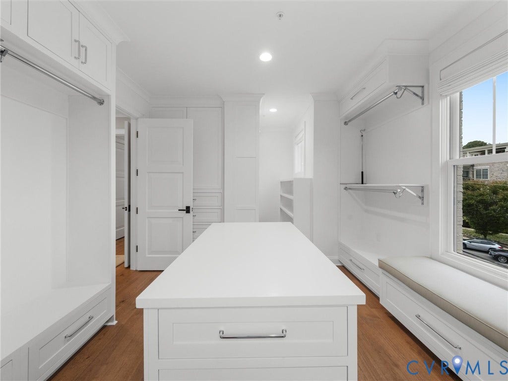 511 Libbie Avenue, #A, The Row At Westhampton, Richmond, VA 23226 Hardwood flooring throughout, custom built-in cabinetry, window seat with integrated storage, central island with drawers, and recessed lighting