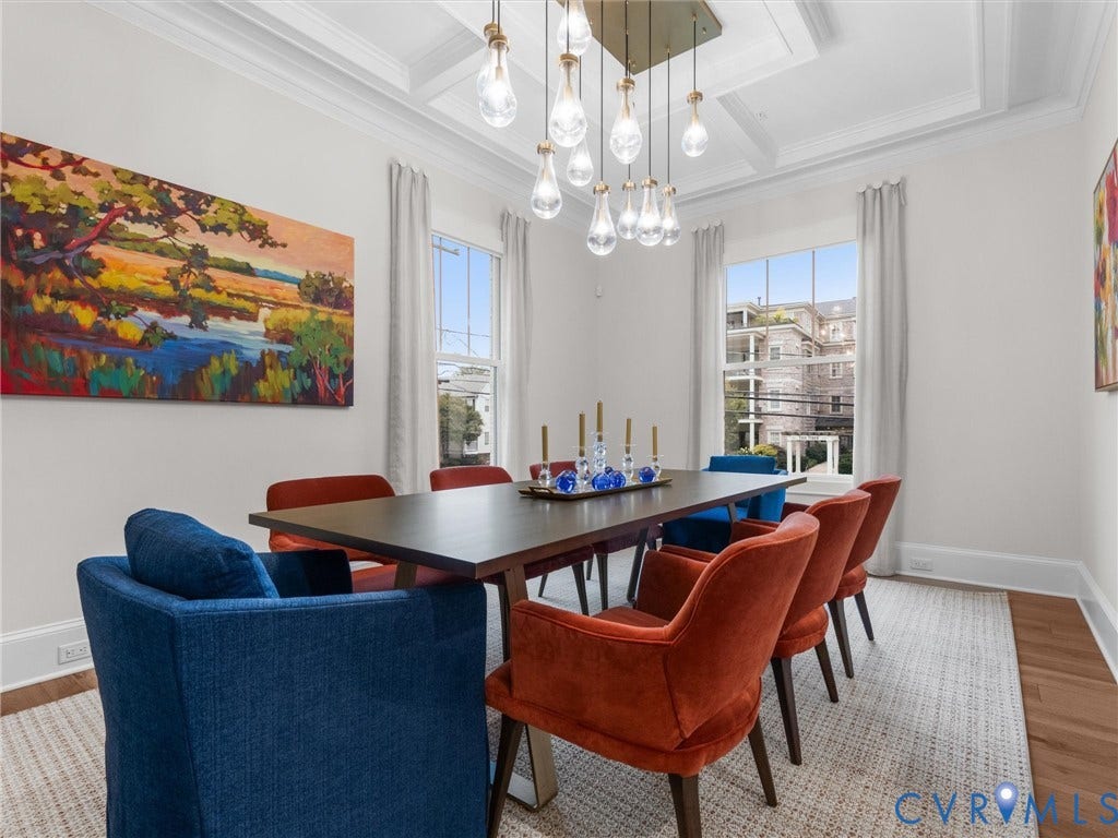 511 Libbie Avenue, #A, The Row At Westhampton, Richmond, VA 23226 Coffered ceiling with a modern chandelier, large windows with white trim, light-toned wall finishes, and wood-finish flooring