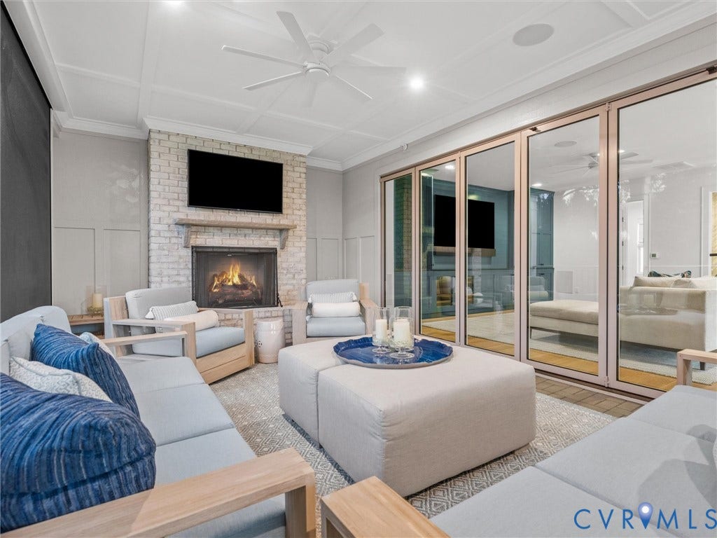 511 Libbie Avenue, #A, The Row At Westhampton, Richmond, VA 23226 White brick fireplace with a wood-mantel, coffered ceiling, ceiling fan, and large glass panel doors