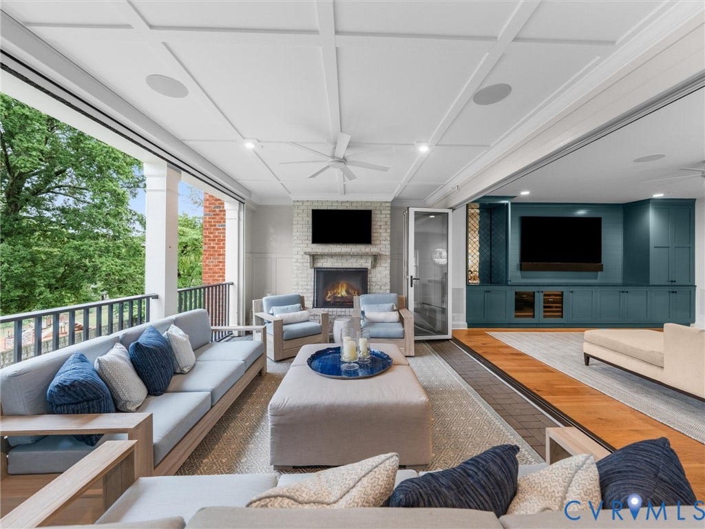 511 Libbie Avenue, #A, The Row At Westhampton, Richmond, VA 23226 Covered porch with coffered ceiling, brick fireplace, and built-in teal cabinetry
