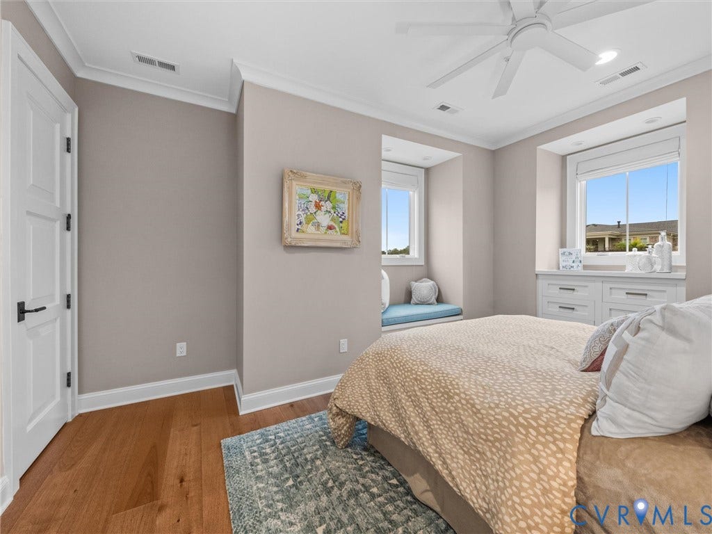 511 Libbie Avenue, #A, The Row At Westhampton, Richmond, VA 23226 Wood-finish flooring, crown molding, and two windows with built-in window seating