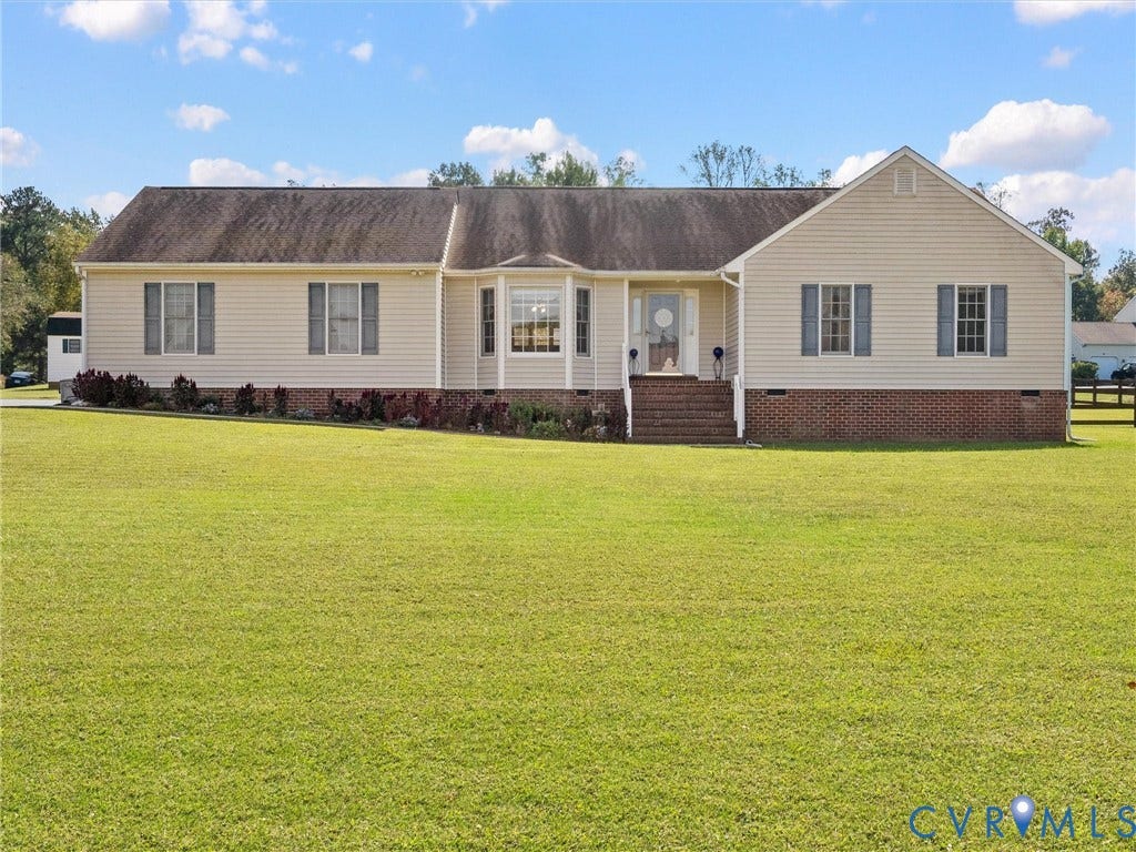 5325 Swift Hill Lane, Scandia Lake, Sandston, VA 23150 Single-story residence featuring light-colored siding, a brick foundation, and a bay window