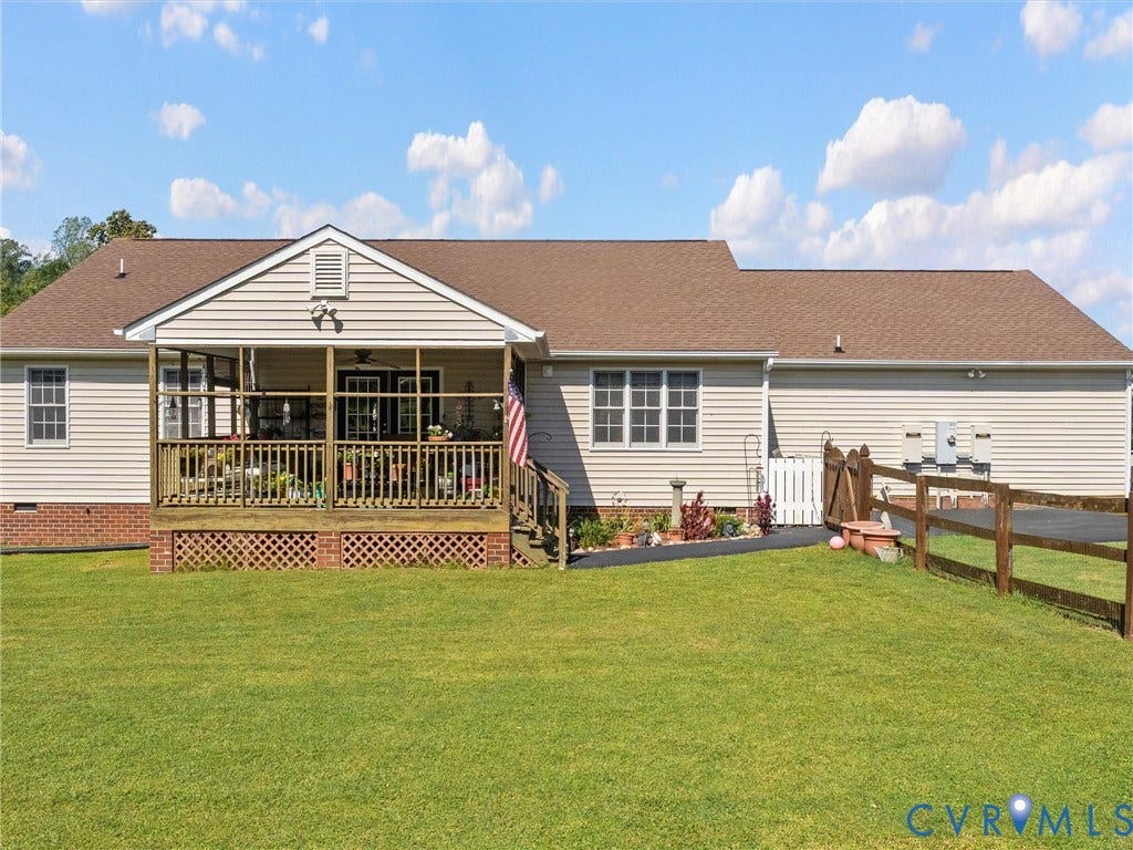 5325 Swift Hill Lane, Scandia Lake, Sandston, VA 23150 Rear exterior featuring a screened-in porch with a wood deck, wood railing, and brick lattice skirting