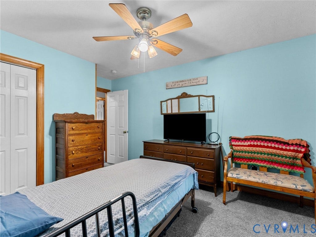 5325 Swift Hill Lane, Scandia Lake, Sandston, VA 23150 Room featuring a ceiling fan with light fixture, carpeted flooring, and light blue walls