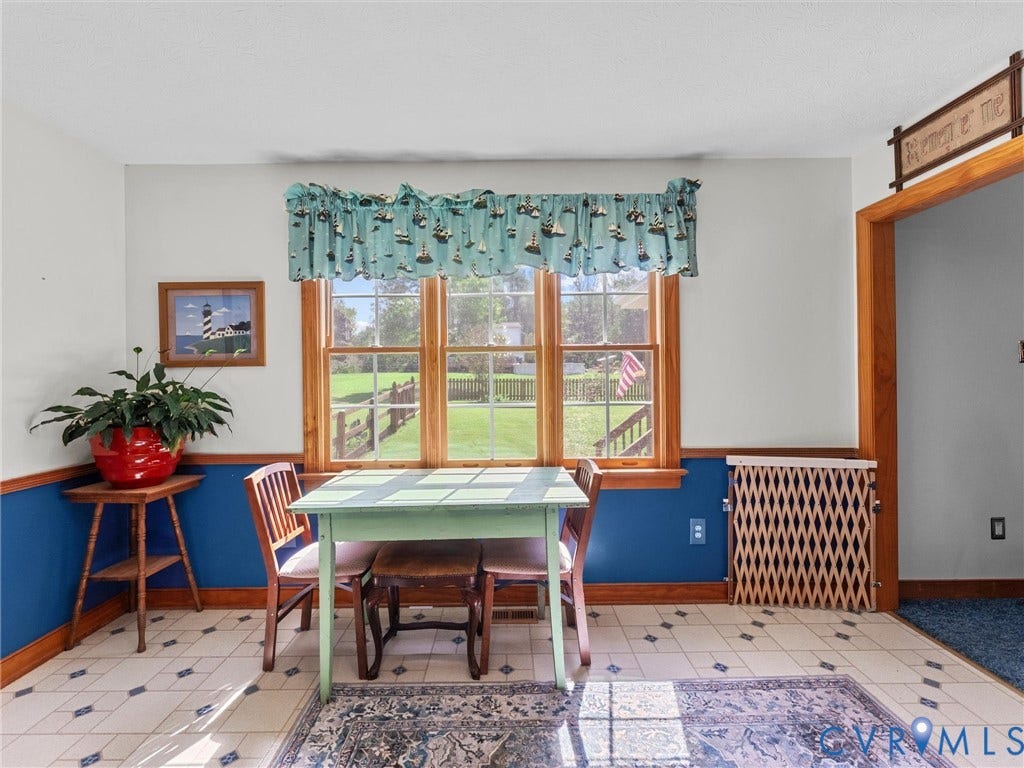 5325 Swift Hill Lane, Scandia Lake, Sandston, VA 23150 Recessed lighting, wood-trimmed window overlooking a fenced yard, tiled flooring with a diamond pattern, wood baseboards, and a wood-framed doorway