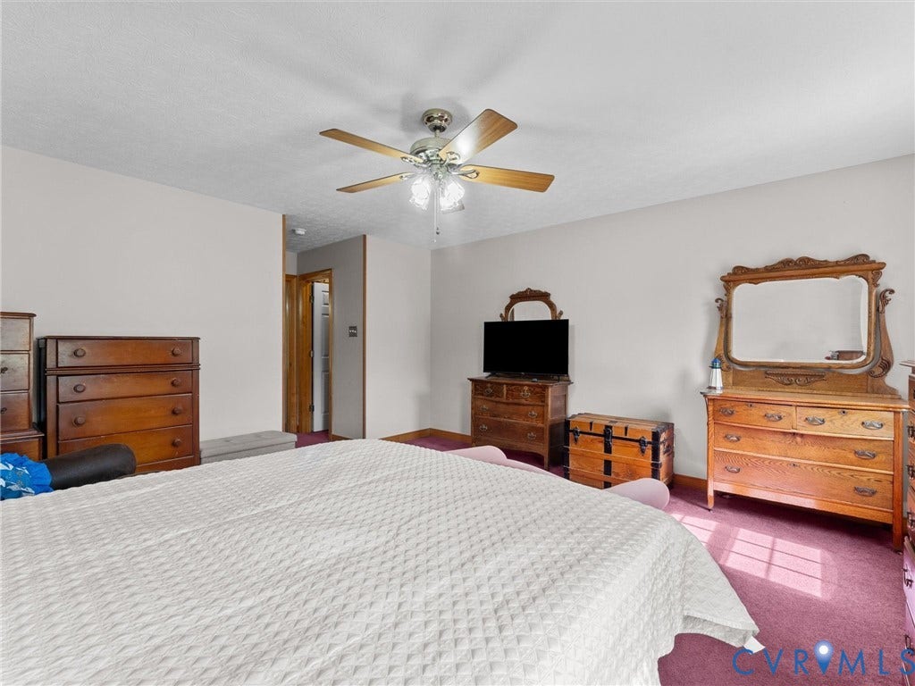 5325 Swift Hill Lane, Scandia Lake, Sandston, VA 23150 Wall-to-wall carpeting and a ceiling fan with light fixture