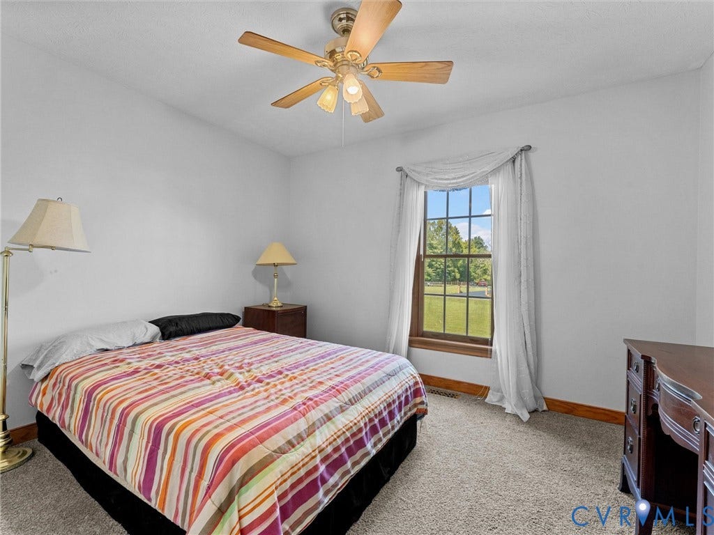 5325 Swift Hill Lane, Scandia Lake, Sandston, VA 23150 Recessed window with wood-finish trim, ceiling fan with integrated lighting, and neutral wall paint