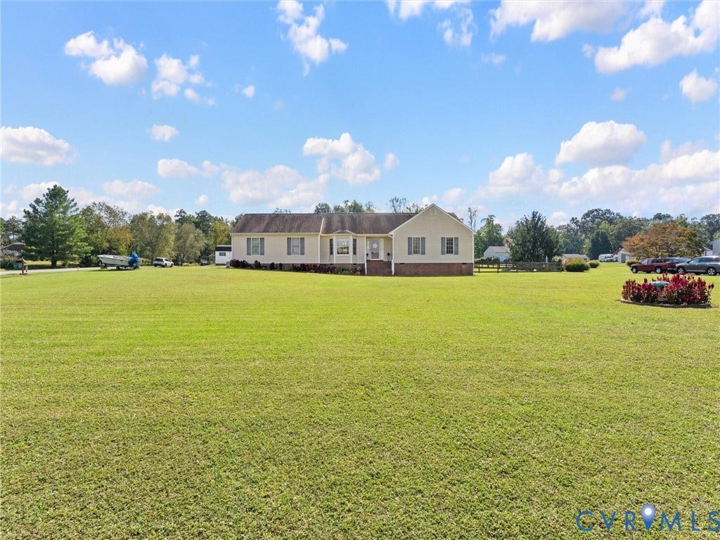 5325 Swift Hill Lane, Scandia Lake, Sandston, VA 23150 Expansive lawn surrounding a single-story residence with a covered front entry