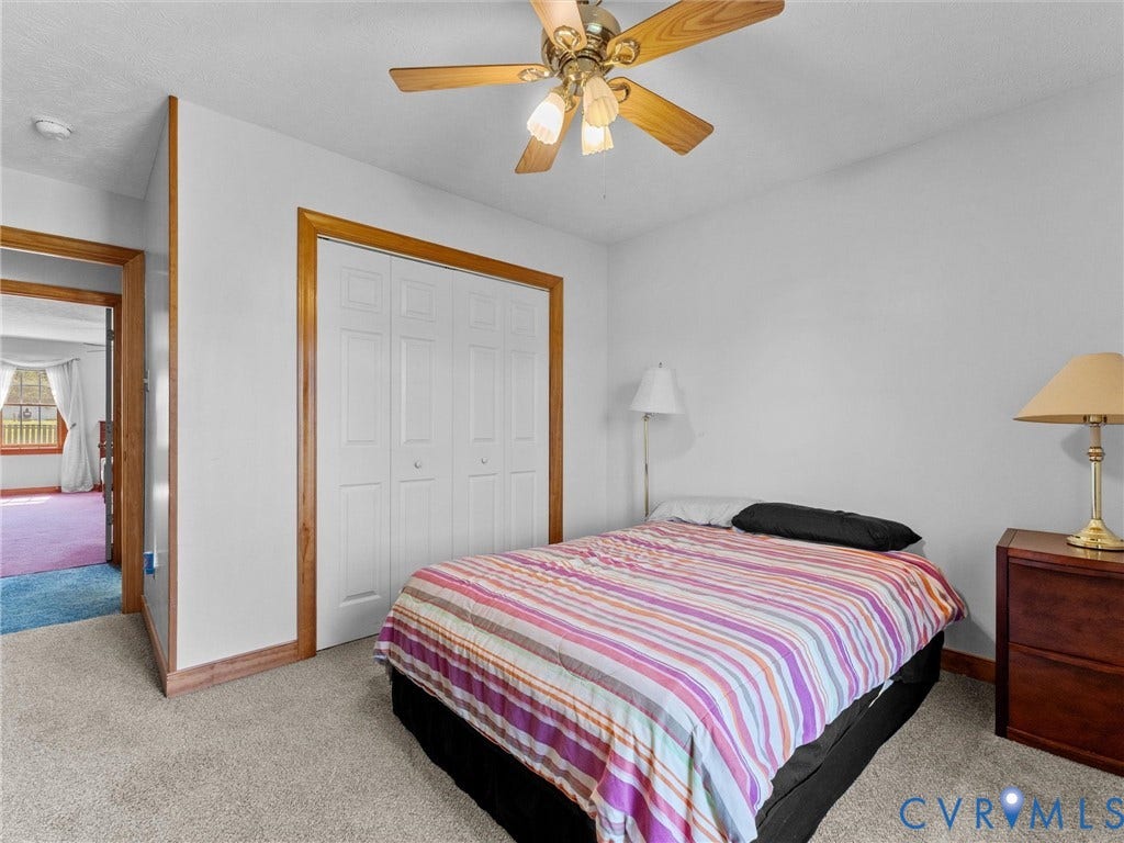 5325 Swift Hill Lane, Scandia Lake, Sandston, VA 23150 Carpeted flooring, ceiling fan, bi-fold closet doors, and wood-trim doorways