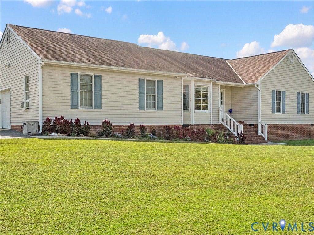 5325 Swift Hill Lane, Scandia Lake, Sandston, VA 23150 Cream-colored siding exterior with a partial brick foundation