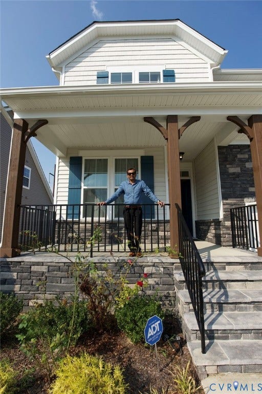 Front facade with white siding and a covered porch