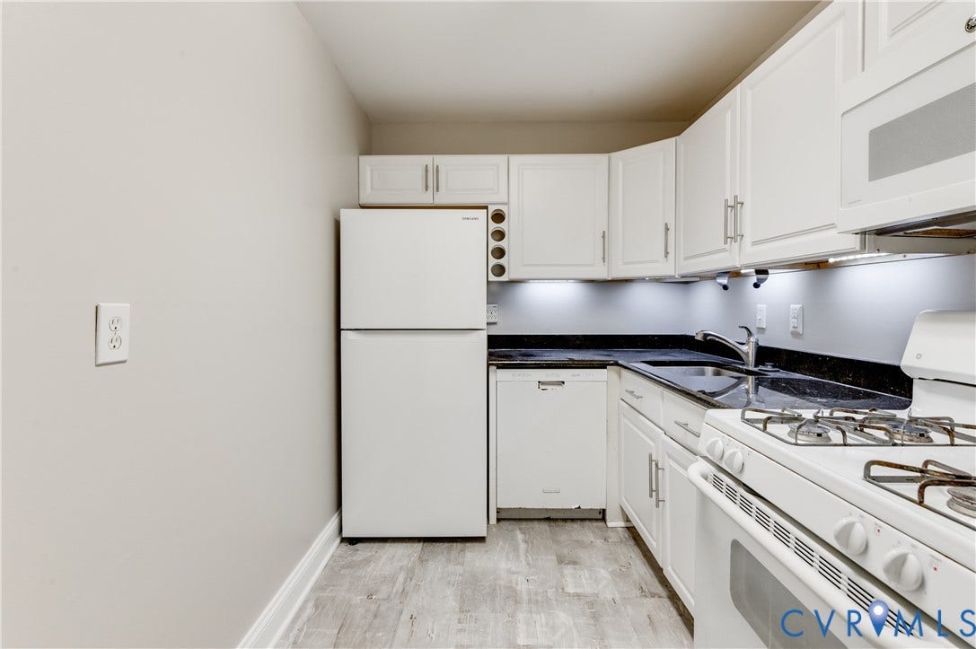 6 Stillwater Lane, Henrico, VA 23228 White cabinetry, dark countertops, white refrigerator, white dishwasher, and wood-finish flooring