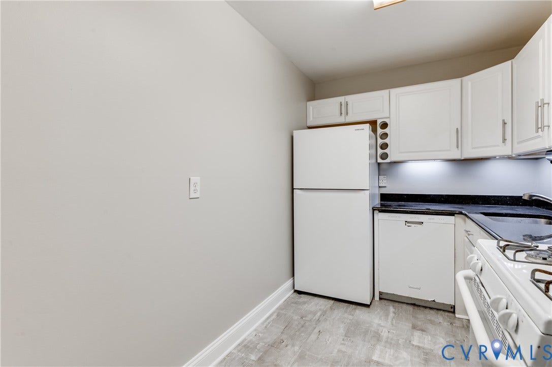 6 Stillwater Lane, Henrico, VA 23228 White cabinetry with silver-tone hardware, black countertop, white refrigerator, white dishwasher, and wood-finish flooring