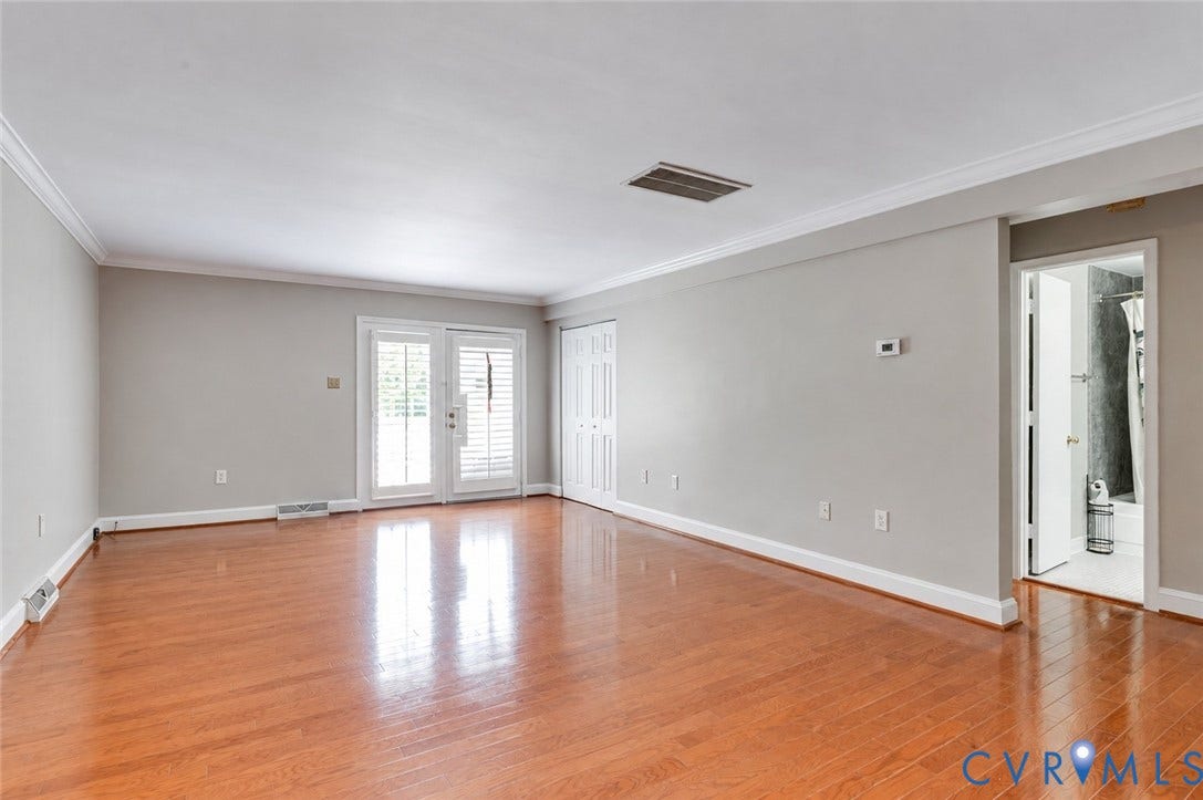 6 Stillwater Lane, Henrico, VA 23228 Wood-finish flooring, crown molding, double French doors with plantation shutters, an interior door, and a bi-fold closet door