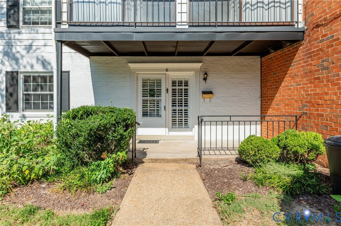 6 Stillwater Lane, Henrico, VA 23228 White brick facade with black window shutters