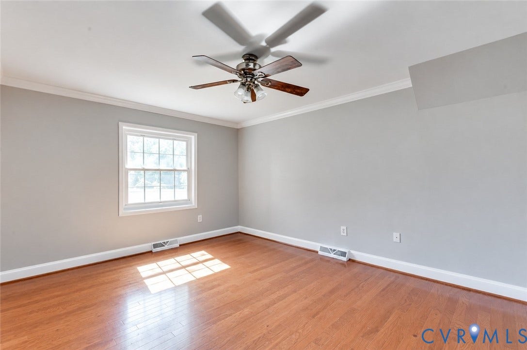 6 Stillwater Lane, Henrico, VA 23228 Wood-finish flooring, white window trim, and a ceiling fan with integrated lighting