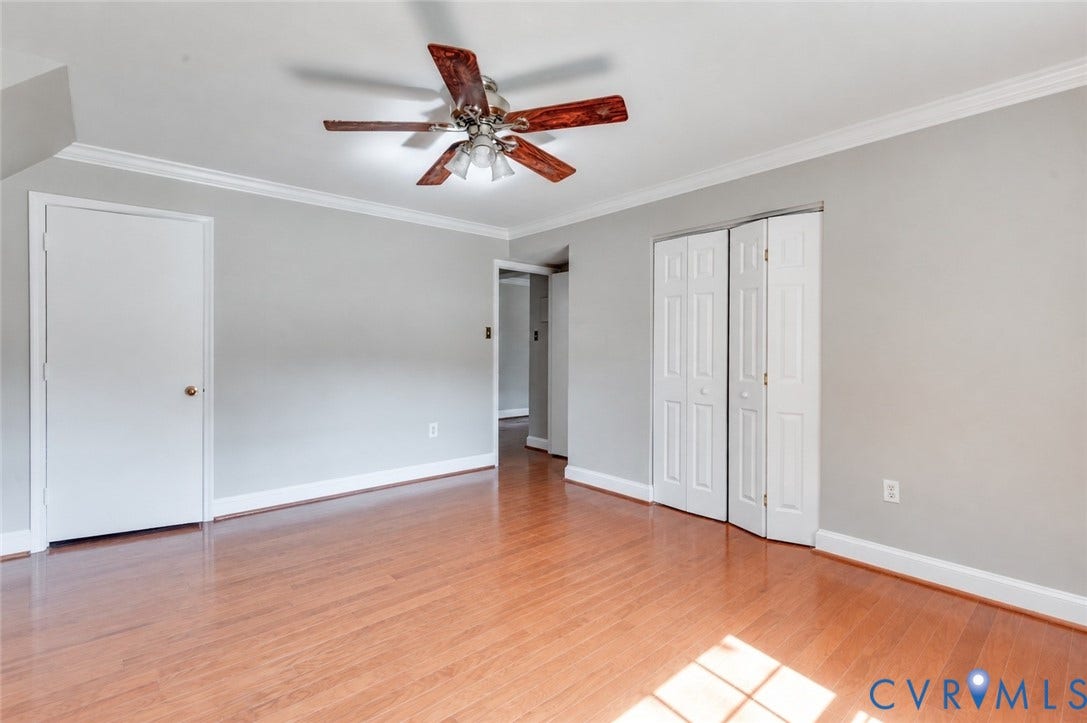 6 Stillwater Lane, Henrico, VA 23228 Wood-finish flooring, ceiling fan with integrated lighting, white trim, and bi-fold closet doors